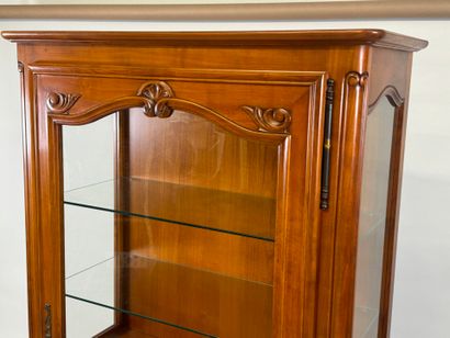 Moulded cherrywood display cabinet opening...