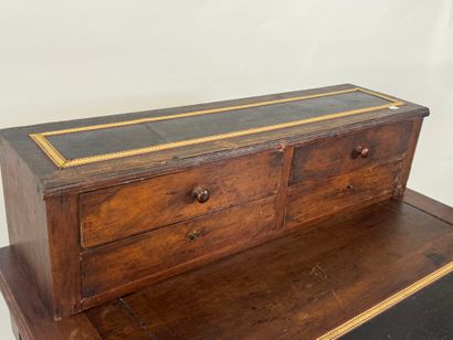 Stained wood stepped desk opening with a...
