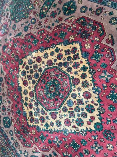 *
Large wool carpet with geometric and stylized...