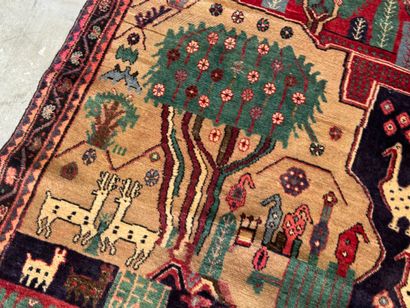 Hand-knotted wool rug decorated with landscapes...