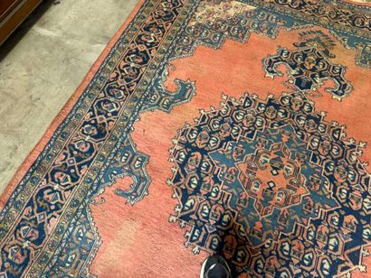 Large hand-knotted wool rug with stylized...