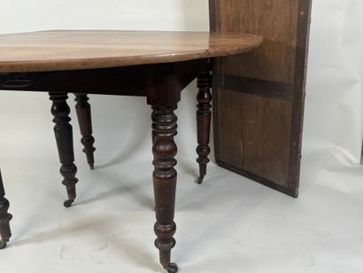Two-leaf table with six molded wood legs.
73...