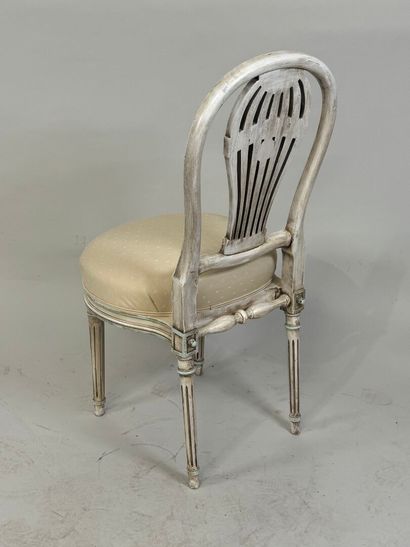 Molded wood chair, the back decorated with...
