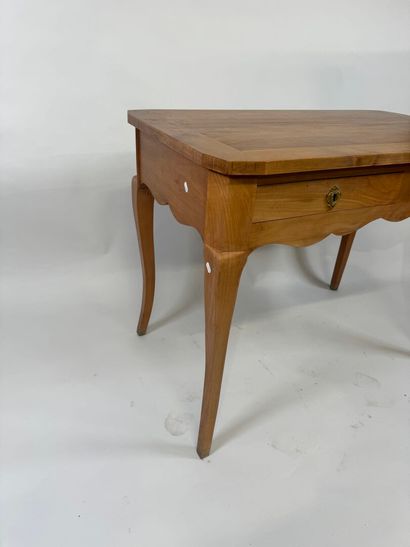 Light wood desk opening with two drawers....
