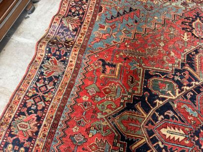 Large hand-knotted wool rug decorated with...