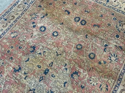 Hand-knotted wool rug decorated with foliate...
