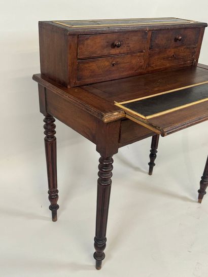 Stained wood stepped desk opening with a...