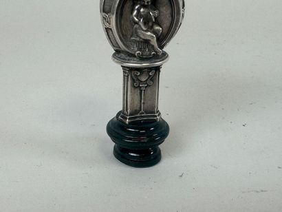 Metal and hardstone cachet with faceted decoration...