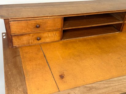 Tiered desk in molded wood opening with three...
