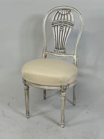 Molded wood chair, the back decorated with...