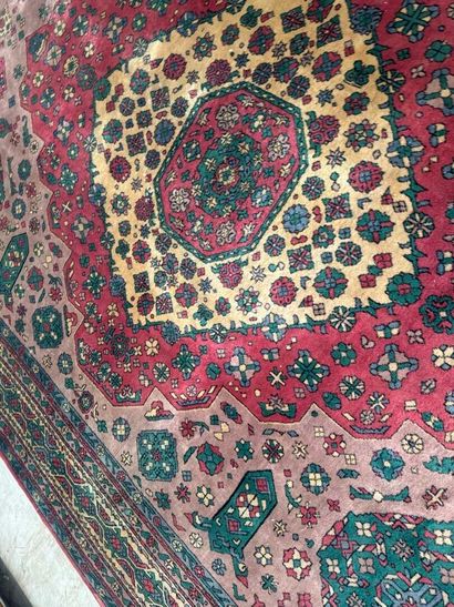 *
Large wool carpet with geometric and stylized...