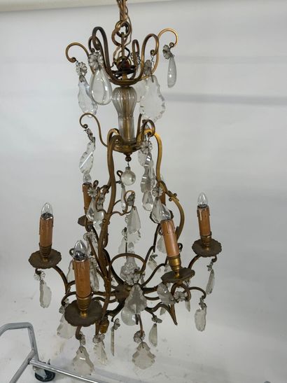 Six-arm bronze chandelier with crystal pendants.
H....