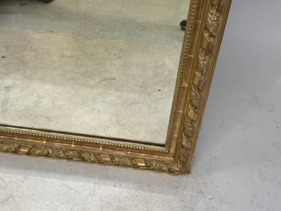 Large wood and gilded stucco mirror with...