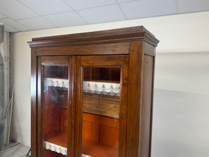 Stained-wood display case opening with two...