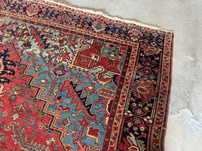Large hand-knotted wool rug decorated with...