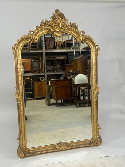 Large gilded and carved wood mirror with...