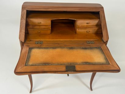 Cherrywood sloping desk opening with a flap...
