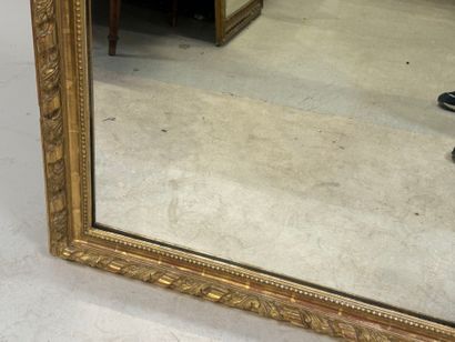 Large wood and gilded stucco mirror with...