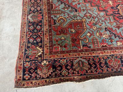Large hand-knotted wool rug decorated with...