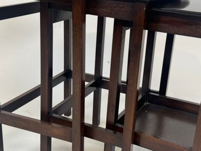 Moulded mahogany nesting tables, one brace...