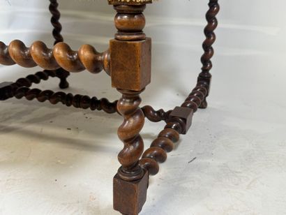 Molded and twisted wood bench, the arms decorated...