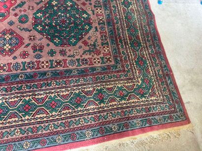 *
Large wool carpet with geometric and stylized...