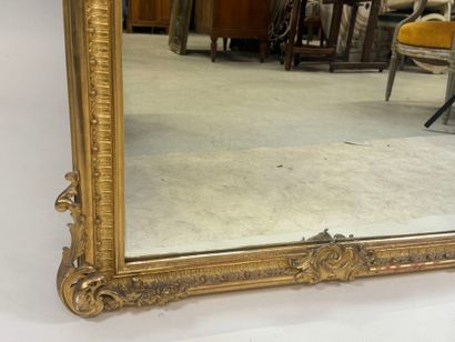 Large gilded and carved wood mirror with...