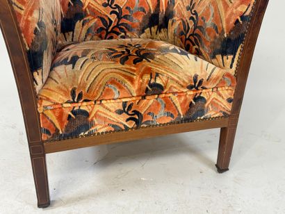 Molded wood armchair with floral velvet upholstery.
70...