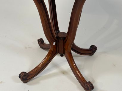 Circular cherrywood pedestal table with scrolls.
20th...
