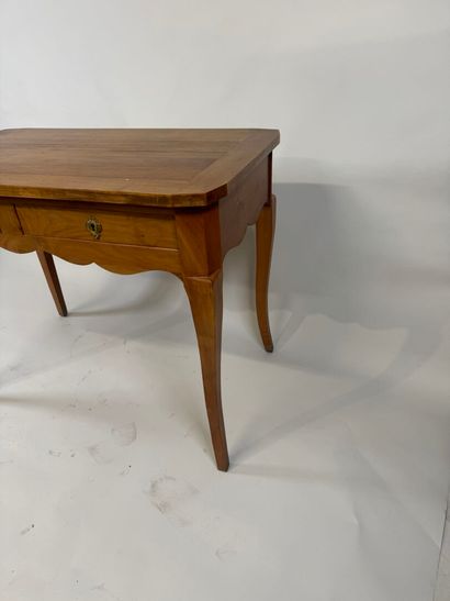 Light wood desk opening with two drawers....