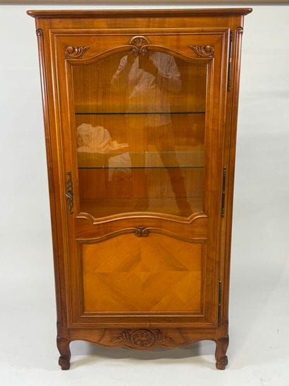Moulded cherrywood display cabinet opening...