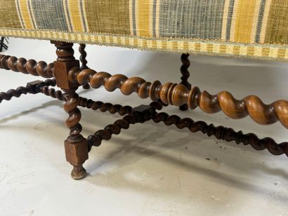 Molded and twisted wood bench, the arms decorated...