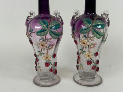 Pair of vases in partially colored and enameled...