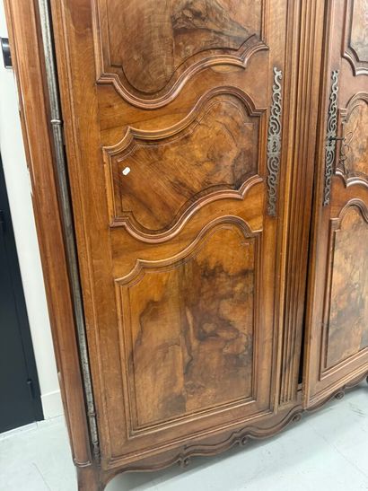 Large walnut armoire opening with two molded...