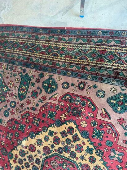 *
Large wool carpet with geometric and stylized...