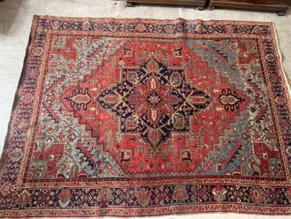 Large hand-knotted wool rug decorated with...