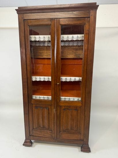 Stained-wood display case opening with two...