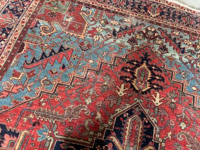 Large hand-knotted wool rug decorated with...