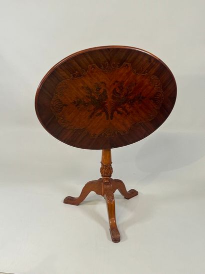 Oval tripod pedestal table in marquetry decorated...