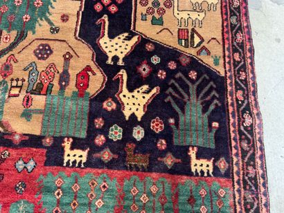 Hand-knotted wool rug decorated with landscapes...