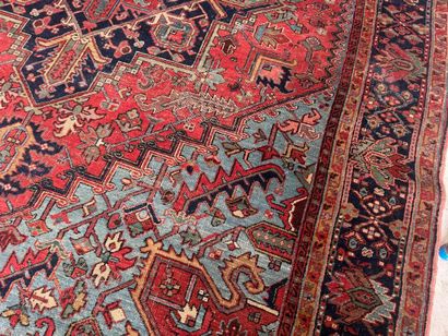 Large hand-knotted wool rug decorated with...