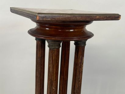 Moulded wood and brass sellette with four...