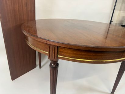 Circular table with molded wood entablature.
Louis...