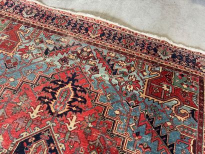Large hand-knotted wool rug decorated with...