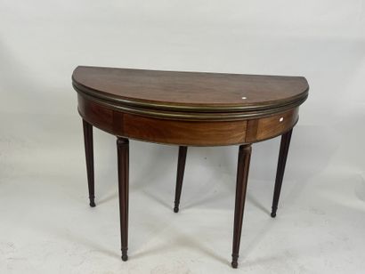Half-moon table in molded wood and brass...