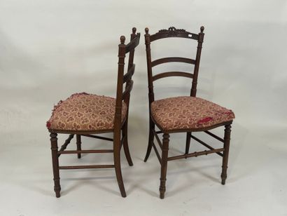 Pair of chairs in molded wood, the openwork...