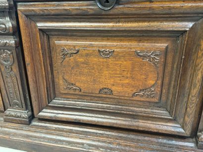 Large molded and carved oak desk decorated...