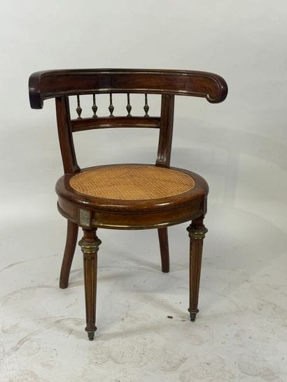 Desk armchair in molded wood and brass, with...