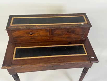 Stained wood stepped desk opening with a...