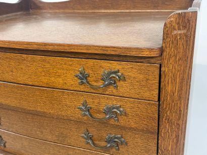 ERCUIS.
Moulded oak silver cabinet opening...